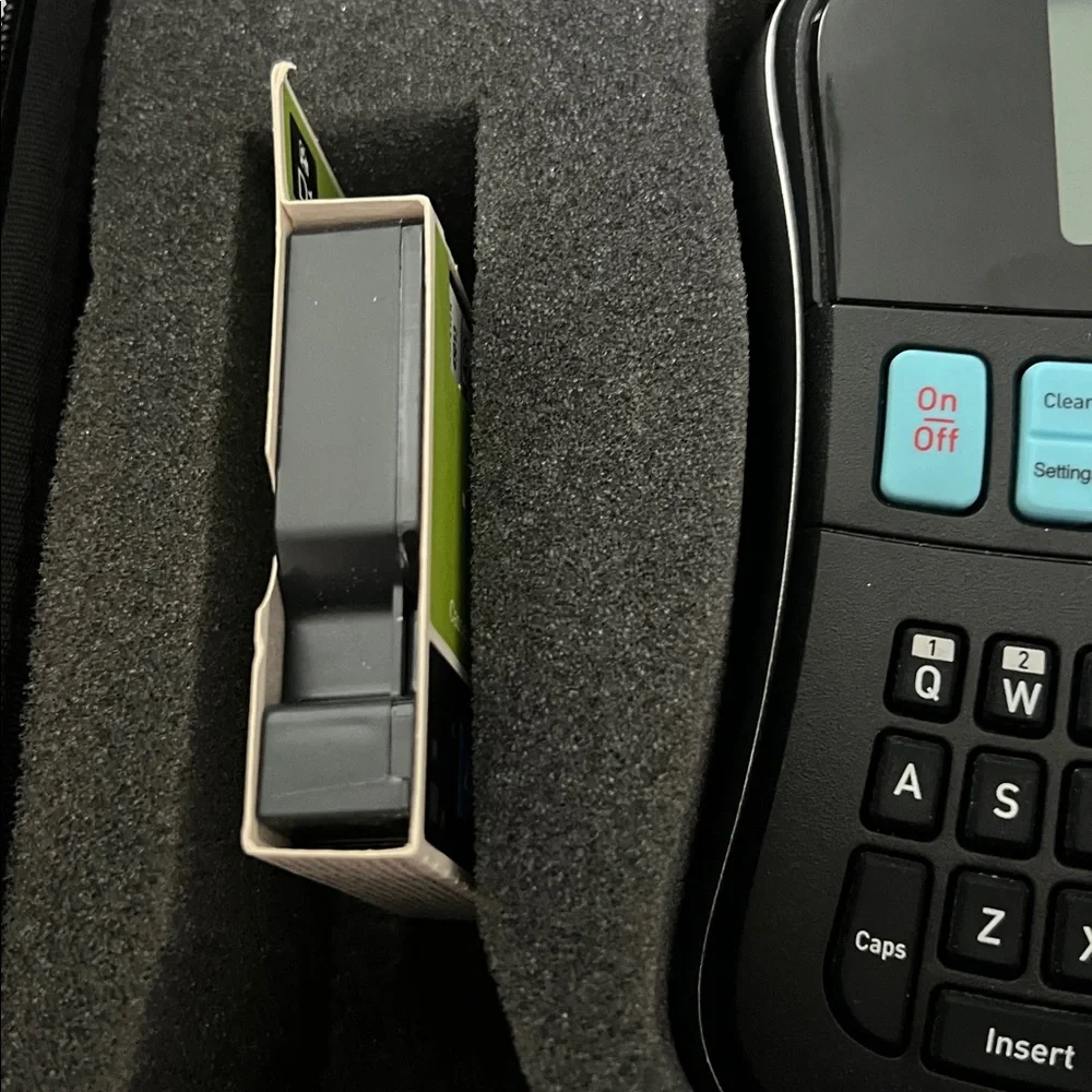DYMO LabelManager 210D label maker with case and three label refills.